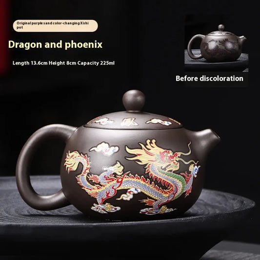 Dragon and phoenix teapot with color-changing feature on a dark background