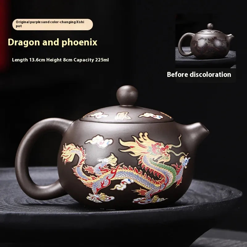 Dragon and phoenix teapot with color-changing feature on a dark background